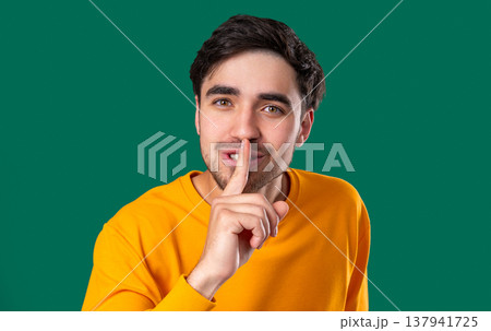 Handsome Man With Gesture Of Shhh, Secret, Silence, Conspiracy, Quiet, Rumors 137941725
