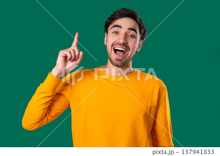 Genius Idea. Resourceful 20S Aged Man Has Eureka Moment, Pointing Finger Up, Remember What He forgot. Memory concept. Genius Idea. Resourceful 20S Aged Man Has Eureka Moment, Pointing Finger Up, Remember What He forgot. Memory concept. 137941833