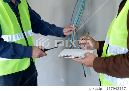Foreman and supervisor are pointing out corrections and installation Foreman and supervisor are pointing out corrections and installation 137942387