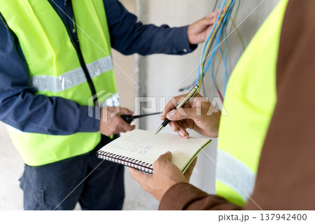 Foreman and supervisor are pointing out corrections and installation Foreman and supervisor are pointing out corrections and installation 137942400