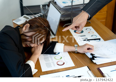boss or chief catches employee sleeping in the office by pointing boss or chief catches employee sleeping in the office by pointing 137942422