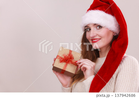 Woman holding gift box. Christmas time Woman holding gift box. Christmas time 137942686