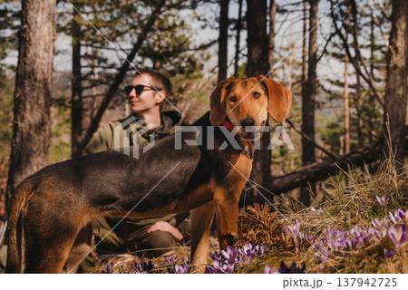 Man Hiking with Hunting Dog in Forest Man Hiking with Hunting Dog in Forest 137942725