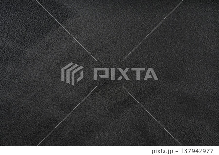 Faux black Suede texture background, Alcantara texture use on premium computer, notebook, car. Surface of leatherette for textured background. Faux black Suede texture background, Alcantara texture use on premium computer, notebook, car. Surface of leatherette for textured background. 137942977