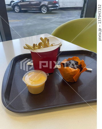 potatoes fried with sauce and cake in open cafe potatoes fried with sauce and cake in open cafe 137943152