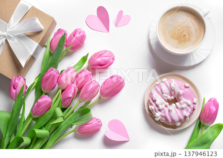 Happy Mother's Day concept flat lay. Pink tulips, coffee, donut and gift box. Happy Mother's Day concept flat lay. Pink tulips, coffee, donut and gift box. 137946123
