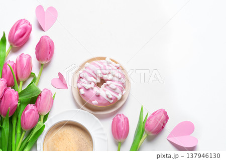 Conceptual template with pink tulips, coffee, donut and hearts. Valentine's Day, Mother's Day. 137946130