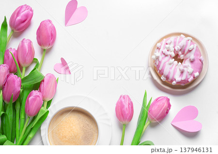 Conceptual template with pink tulips, coffee, donut and hearts. Valentine's Day, Mother's Day. 137946131