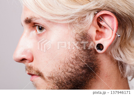 Pierced man ear, black plug tunnel, industrial and rook Pierced man ear, black plug tunnel, industrial and rook 137946171