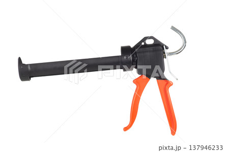 Professional caulking gun with orange handle isolated on white background. Silicone sealant applicator tool 137946233