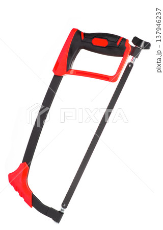 Modern hacksaw with red and black handle isolated on white background. Professional metal cutting hand tool Modern hacksaw with red and black handle isolated on white background. Professional metal cutting hand tool 137946237