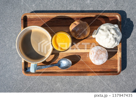 Flemish indulgent coffee set on sunny terrace 137947435