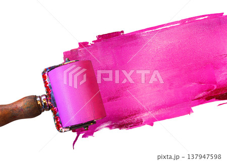 Closeup of a pink ink roller with a wooden handle applying a bold magenta layer of paint across a white background. Dynamic motion of the printing too Closeup of a pink ink roller with a wooden handle applying a bold magenta layer of paint across a white background. Dynamic motion of the printing too 137947598
