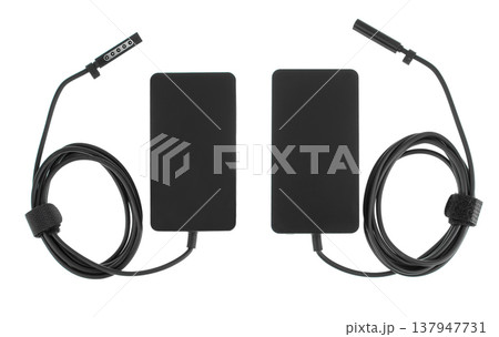 laptop power adapter, laptop spare part, on white background, top view 137947731