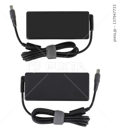 laptop power adapter, laptop spare part, on white background, top view 137947733