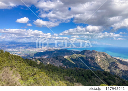 Panoramic view unfolds from the scenic hiking path leading to Mijas peak, showcasing the stunning landscapes of Andalusia, Malaga, Spain Panoramic view unfolds from the scenic hiking path leading to Mijas peak, showcasing the stunning landscapes of Andalusia, Malaga, Spain 137948941