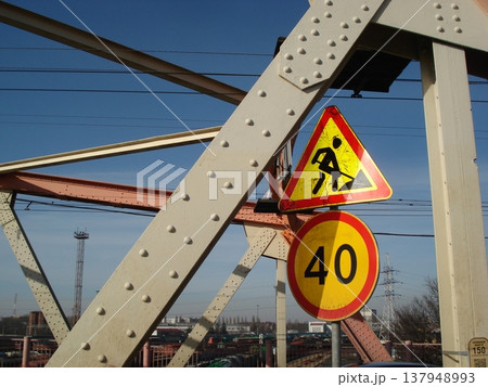 Road signs against the backdrop of the bridge's steel structure 137948993