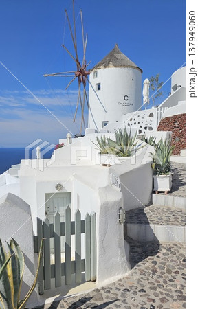 Traditional white windmill with thatched roof in Oia, Santorini, Traditional white windmill with thatched roof in Oia, Santorini, 137949060