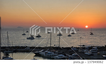 view of a marina filled with boats at sunset view of a marina filled with boats at sunset 137949062