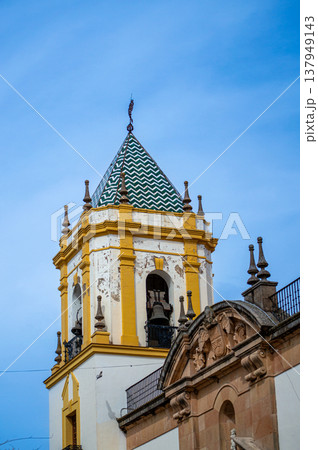 Walking along ancient streets enjoying historic architecture and charming atmosphere in Ronda, Spain. 137949143