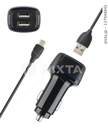 power adapter for the phone from the cigarette lighter, on a white background power adapter for the phone from the cigarette lighter, on a white background 137949842