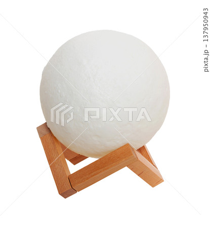 moon lamp on a wooden stand, on a white background in isolation moon lamp on a wooden stand, on a white background in isolation 137950943