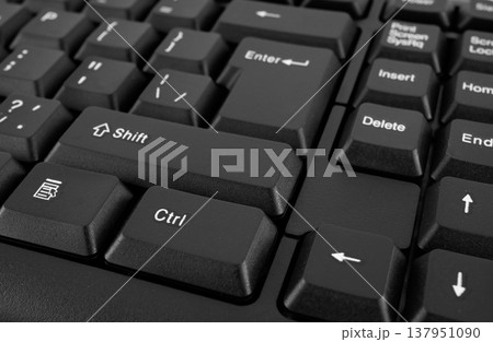 Part of a computer keyboard, black close-up Part of a computer keyboard, black close-up 137951090