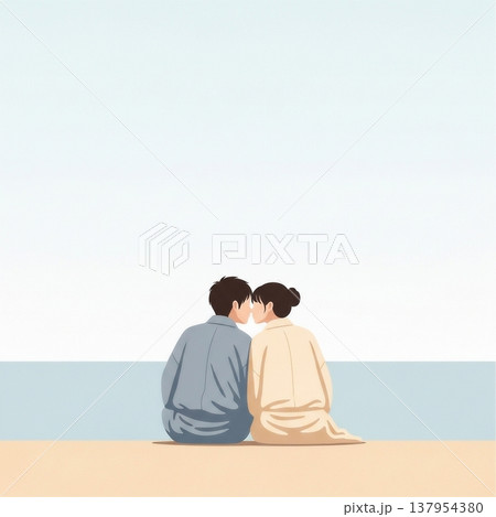 青空の下の砂浜に座ってキスをする男女の若いカップル 137954380