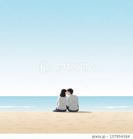 青空の下の砂浜に座ってキスをする男女の若いカップル 137954384