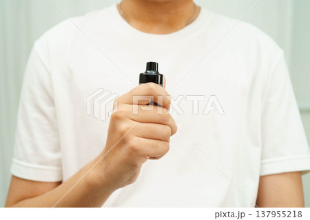 Man holding electronic cigarettes, no smoking. 137955218