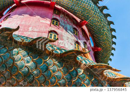 Giant Dragon Coiled Around Pink Tower, Wat Sam Phran or Dragon temple Nakhon Pathom, Thailand 137956845