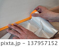 Applying Tape for Painting Preparation 137957152