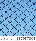 Chain-link fence with blue sky 137957304