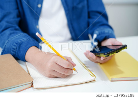 Teenage using smart phone for communication, search data internet website to learn. Teenage using smart phone for communication, search data internet website to learn. 137958189
