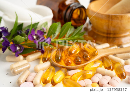 Alternative medicine herbal organic capsule with vitamin E omega 3 fish oil, mineral, drug with herbs leaf natural supplements for healthy good life. Alternative medicine herbal organic capsule with vitamin E omega 3 fish oil, mineral, drug with herbs leaf natural supplements for healthy good life. 137958357