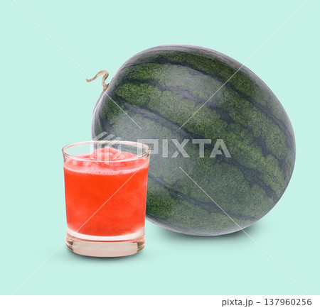 Fresh watermelon and watermelon smoothie, healthy summer drink concept on green background. Fresh watermelon and watermelon smoothie, healthy summer drink concept on green background. 137960256