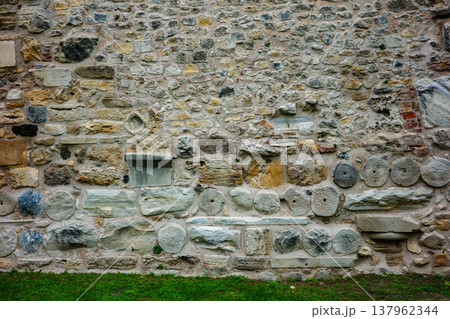 Ancient weathered stone brick wall texture pattern 137962344