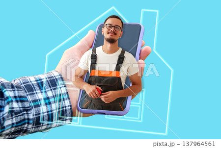 Online home repair and handyman service concept. Hand holding a smartphone with a professional repairman on the screen. Digital maintenance and house renovation app concept 137964561
