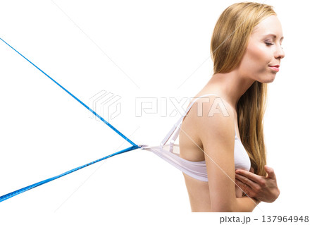 Woman wearing too big bra, loose band Woman wearing too big bra, loose band 137964948