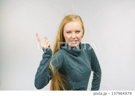 Woman pointing finger displeased 137964979