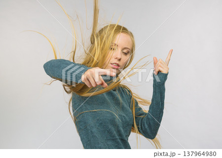 Woman pointing and shaking her finger 137964980