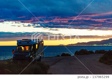 Camper on coast at sunset Camper on coast at sunset 137965299