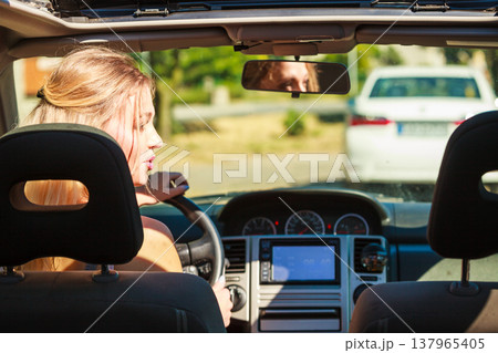 Woman driving car Woman driving car 137965405