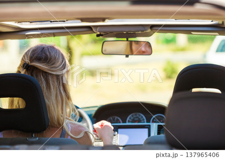 Woman driving car Woman driving car 137965406