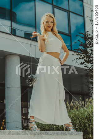 Woman wearing crop top and culottes Woman wearing crop top and culottes 137965458