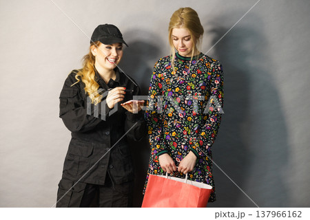 Security guard and blonde girl . Security guard and blonde girl . 137966162