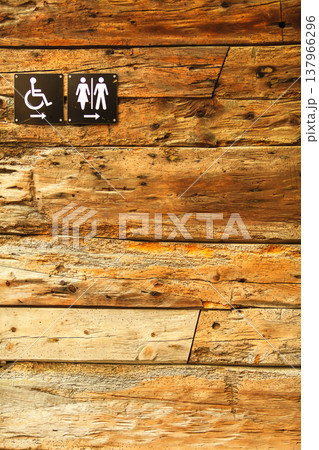 Sign of public toilets WC on wooden background Sign of public toilets WC on wooden background 137966296