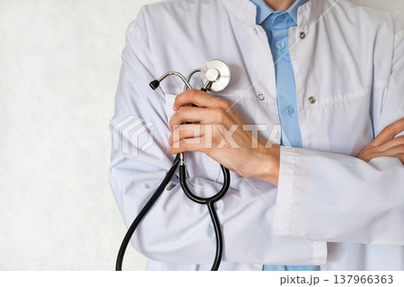 Discussing patient care at a medical office with stethoscope and medications present Discussing patient care at a medical office with stethoscope and medications present 137966363