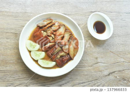 roasted duck meat and red barbecue pork with cucumber dressing sweet gravy soy sauce on plate roasted duck meat and red barbecue pork with cucumber dressing sweet gravy soy sauce on plate 137966833