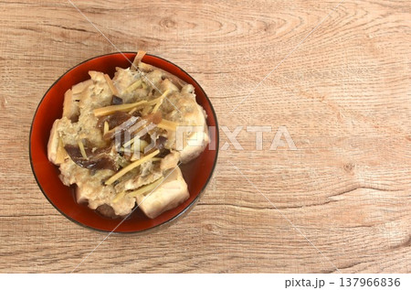 steamed white tofu stuffed mashed pork with black ear mushroom and slice ginger in soy sauce on bowl steamed white tofu stuffed mashed pork with black ear mushroom and slice ginger in soy sauce on bowl 137966836
